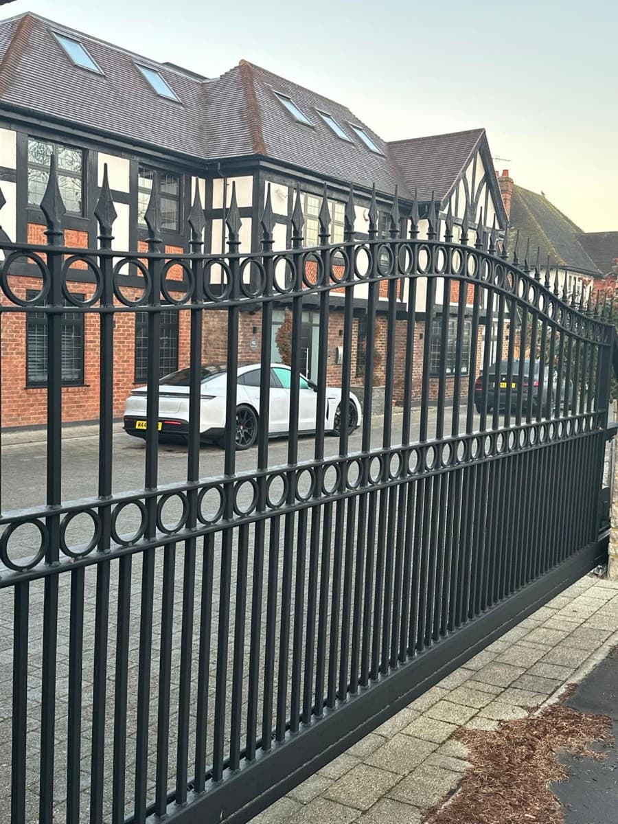 Classic ornate bifold steel gate, Tudor style
