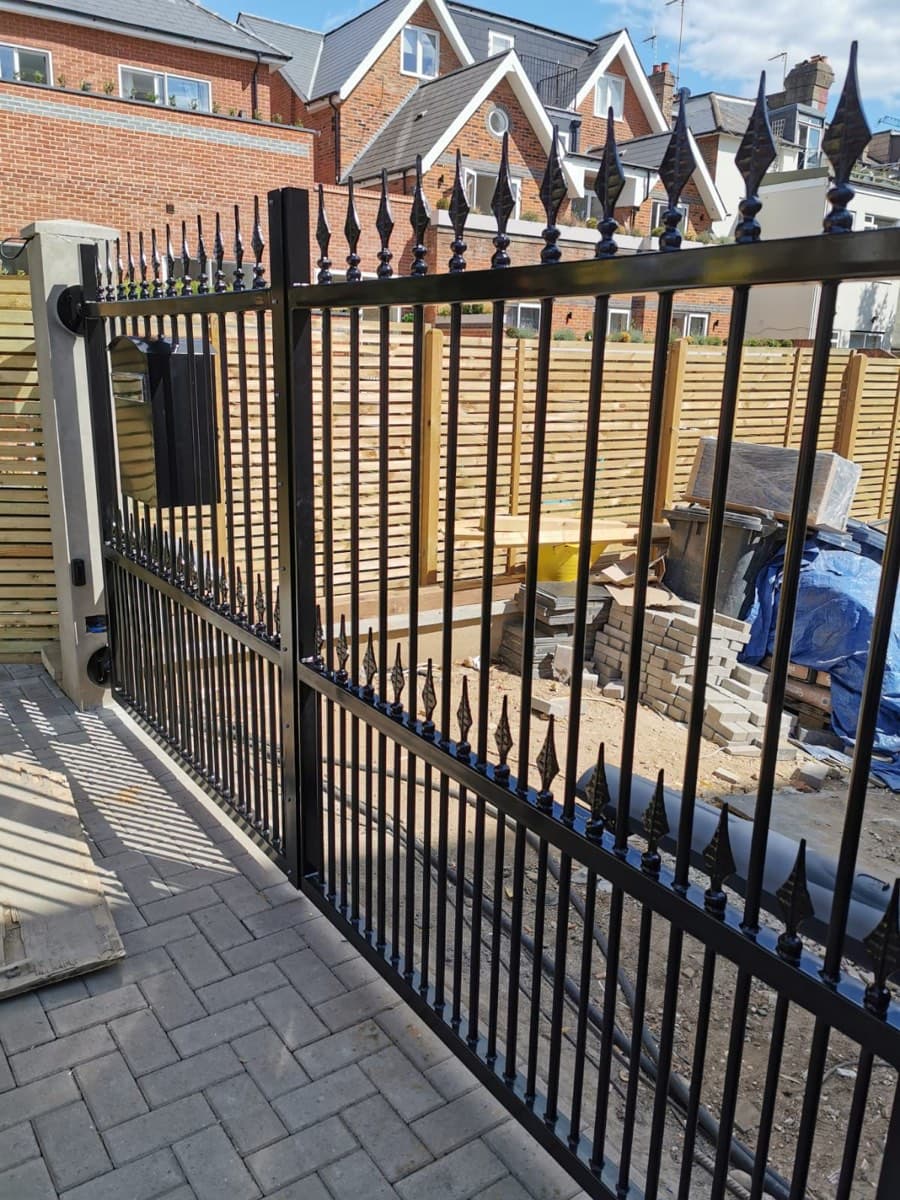 Cantilever steel gate with spear finials
